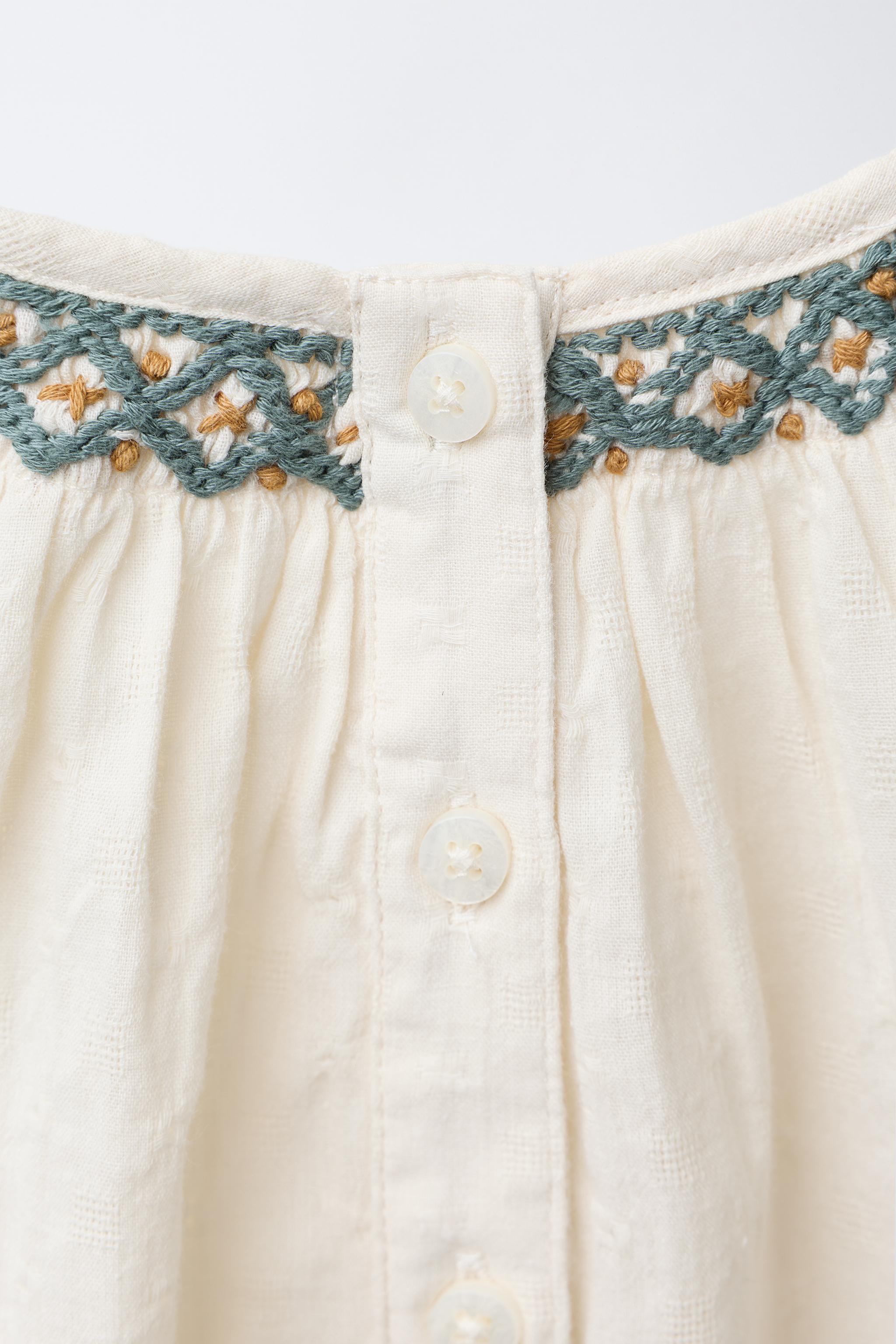 CONTRAST EMBROIDERED BODYSUIT